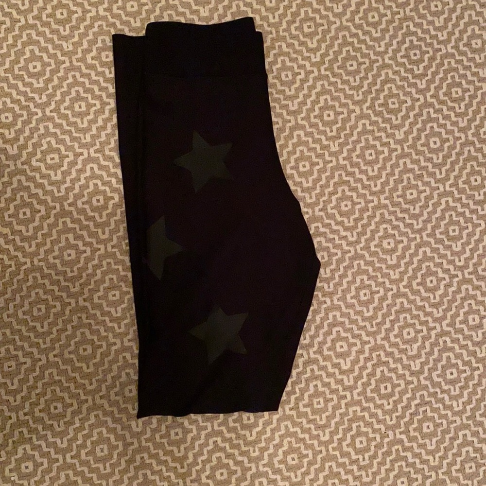 Ultracor high waist leggings with black stars.